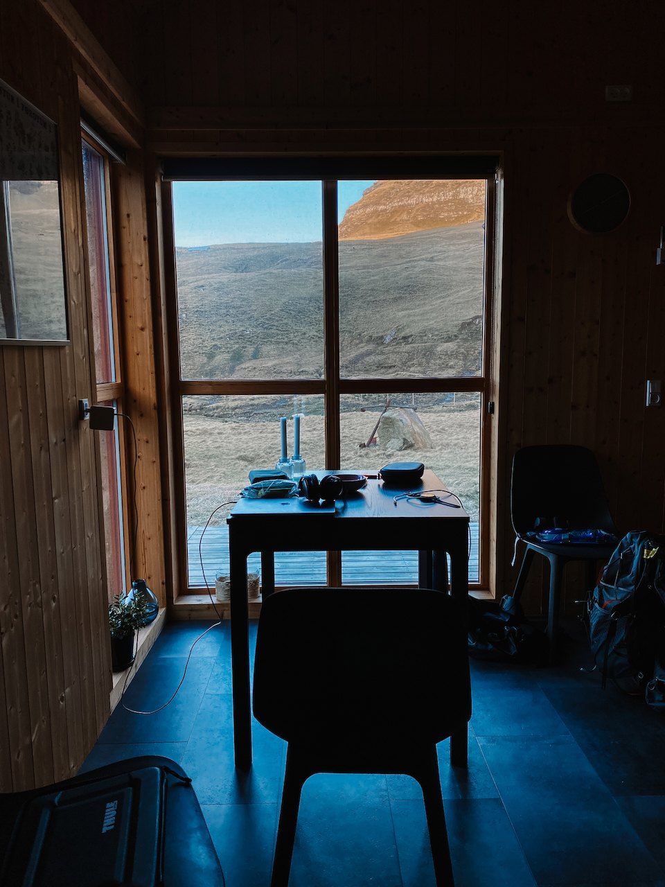A desk at the window of a cabin on the Faroe Islands